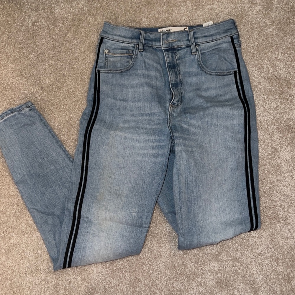 Light wash Jean with black stripe on sides of legs, size 5